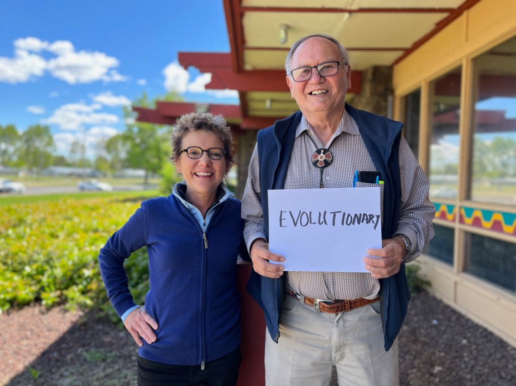 President Mary C. Daly alongside Chairman Delano Saluskin holding his one word description of Yakama Nation. The one word description is Evolutionary.