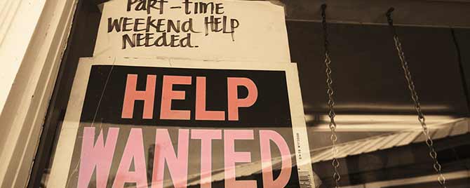 Help Wanted sign on window
